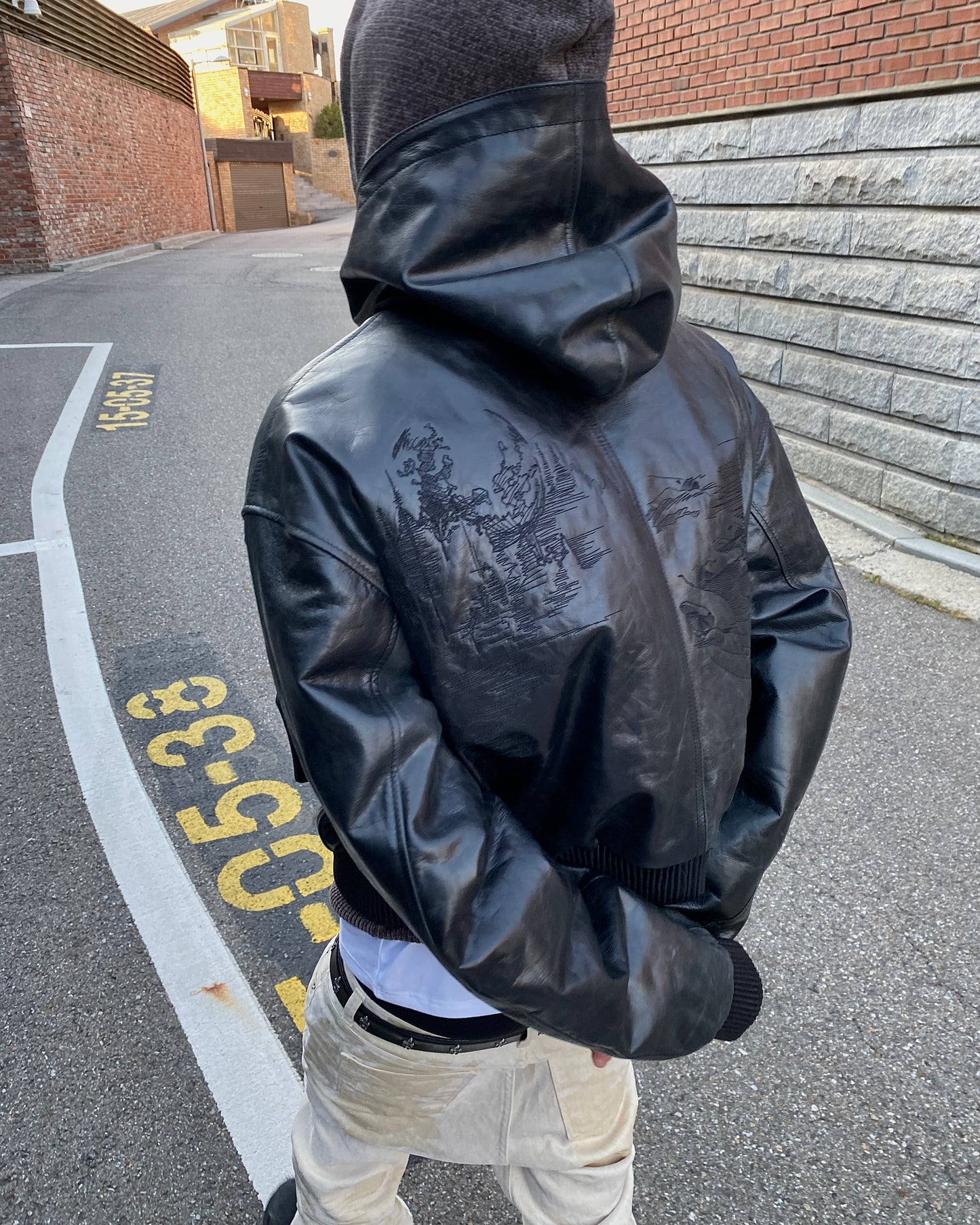Undermycar LONE WOLF WITH CRESCENT MOON EMBROIDERED LEATHER HOODED BOMBER
